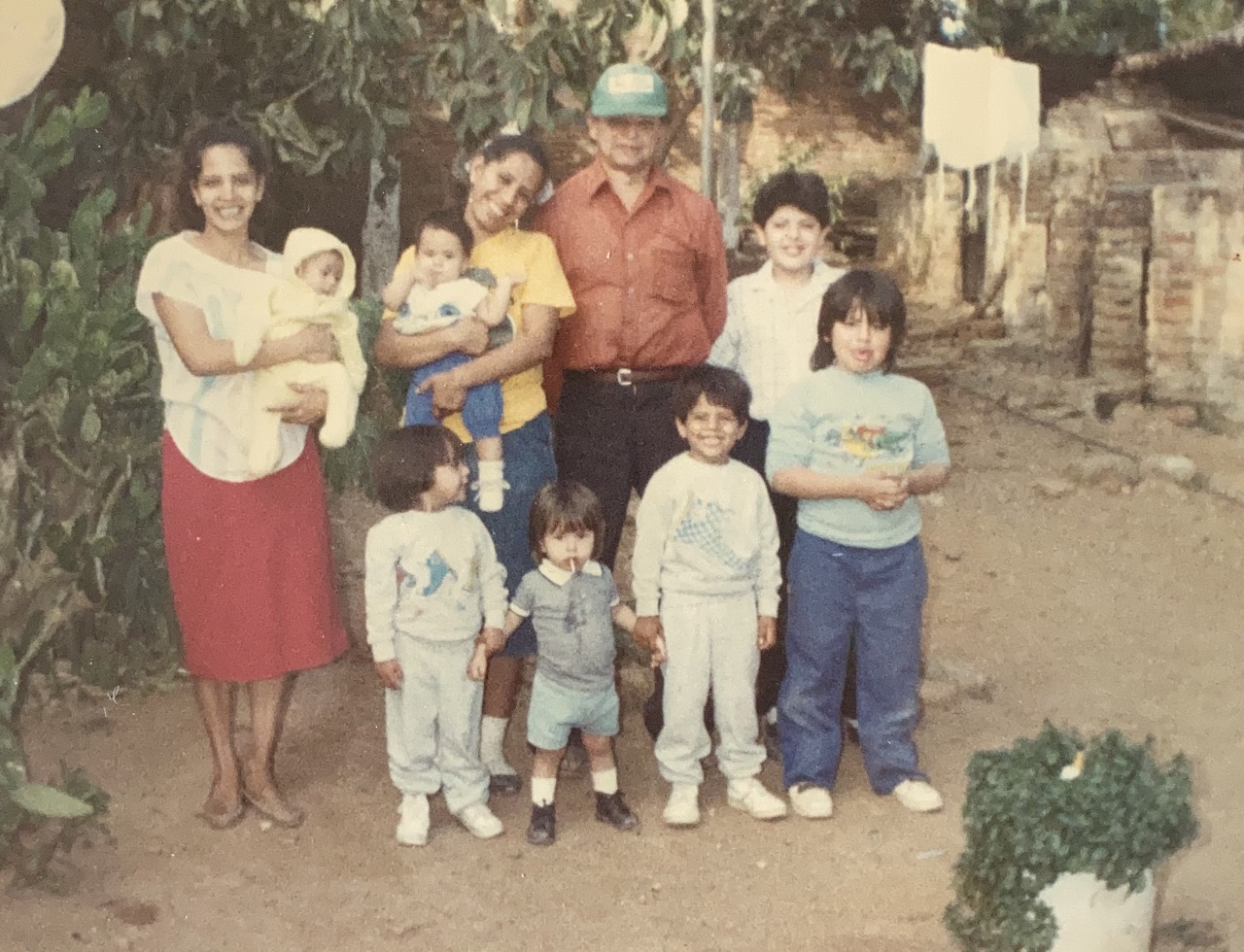 The Molina kids, tia Rosa, tia Chayo and cousins with their abuelo Don Chevio in the late 1980s